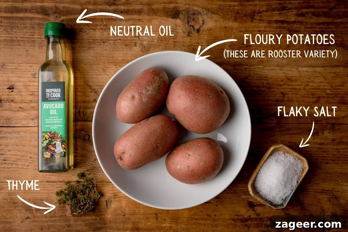 Ultra-Crisp Air Fryer Roast Potatoes 4 A flat lay image displaying all the simple ingredients for air fryer roast potatoes on a rustic wooden table. Each ingredient is clearly labeled with white text and an arrow pointing to it: potatoes, neutral oil, Maldon salt, and fresh thyme.