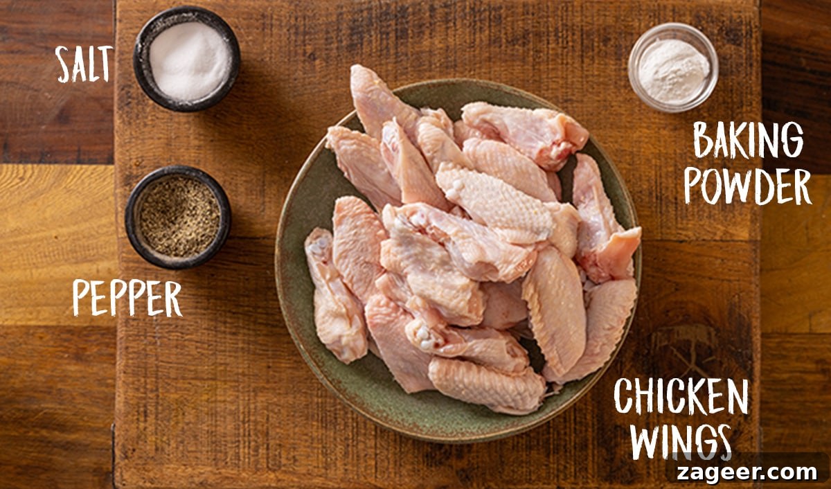 Perfectly Crispy Air Fryer Wings 3 Ingredients for crisp chicken wings on a wooden table