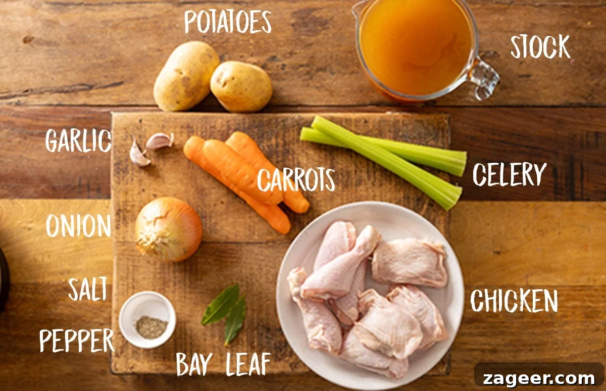 Hearty Slow Cooker Chicken and Veggie Bowl 3 Clearly labelled ingredients for slow cooker Chicken & Vegetable soup are neatly arranged on a rustic wooden board, showcasing fresh vegetables, bone-in chicken, and seasonings.