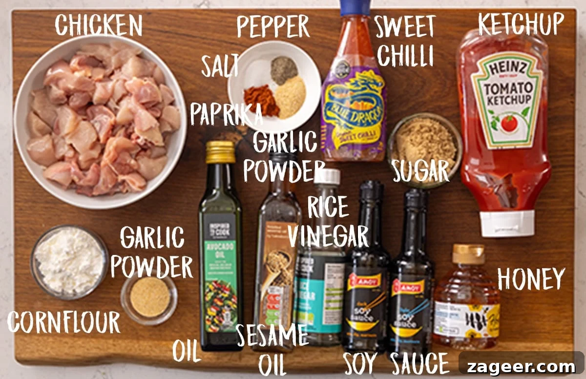 Crispy Air-Fried Sesame Chicken 3 Ingredients for air fryer sesame chicken on a wooden board. The ingredients are labelled in white text.