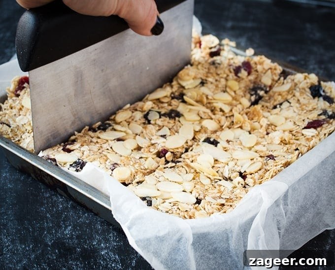 Close-up of Berry Bakewell Granola Bars showing oats, berries, and almonds