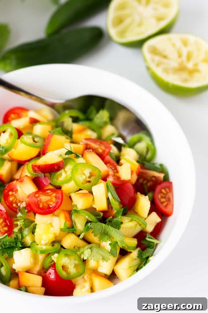 Sunshine Peach Pineapple Salsa 2 Fresh Peach and Pineapple Salsa with a Jalapeño kick, served in a bowl.