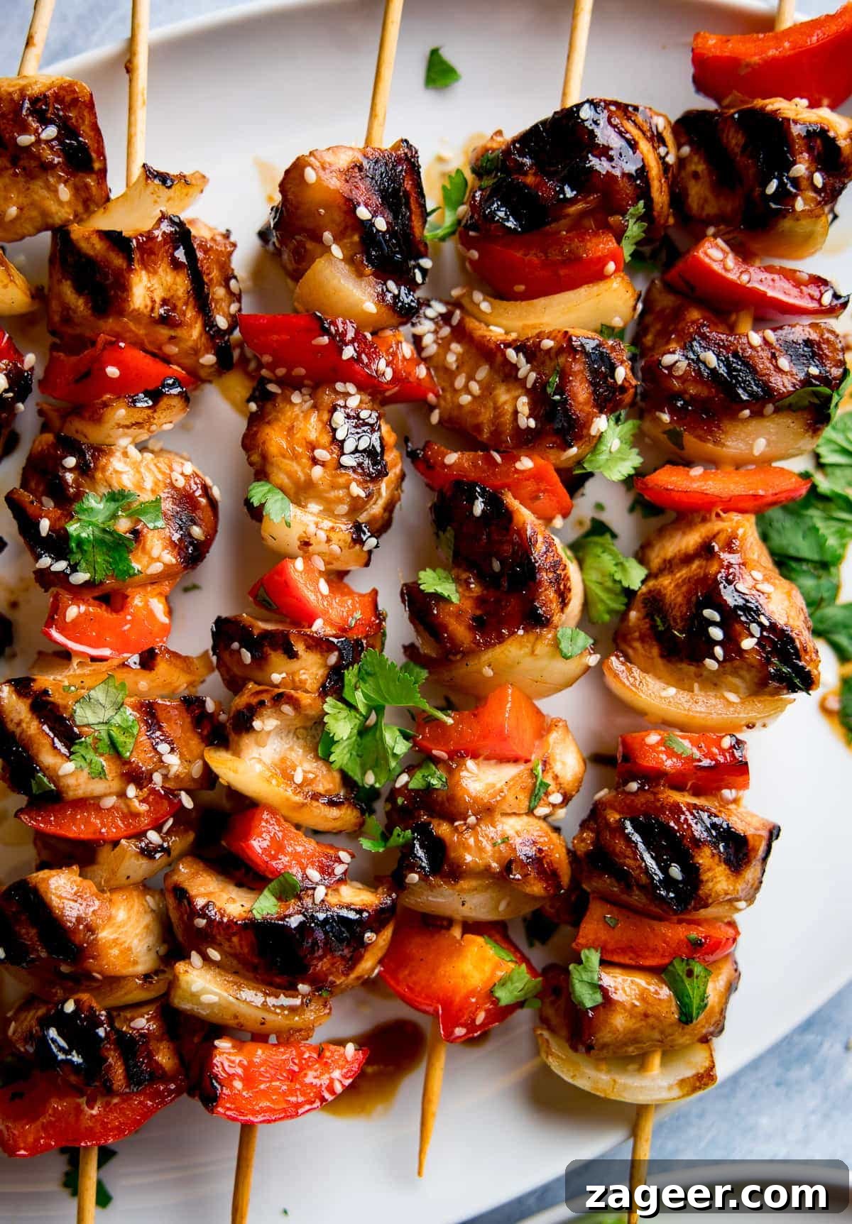 Sticky Honey Garlic Chicken Skewers 5 Perfectly cooked honey garlic chicken skewers dusted with sesame seeds, ready to be served