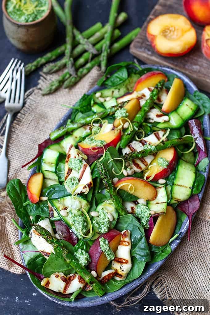Golden Halloumi Peach Salad with Zesty Lemon Pesto 3 A close-up shot of the vibrant Griddled Halloumi and Peach Salad ingredients before assembly, featuring grilled courgette, asparagus, and fresh lemon.