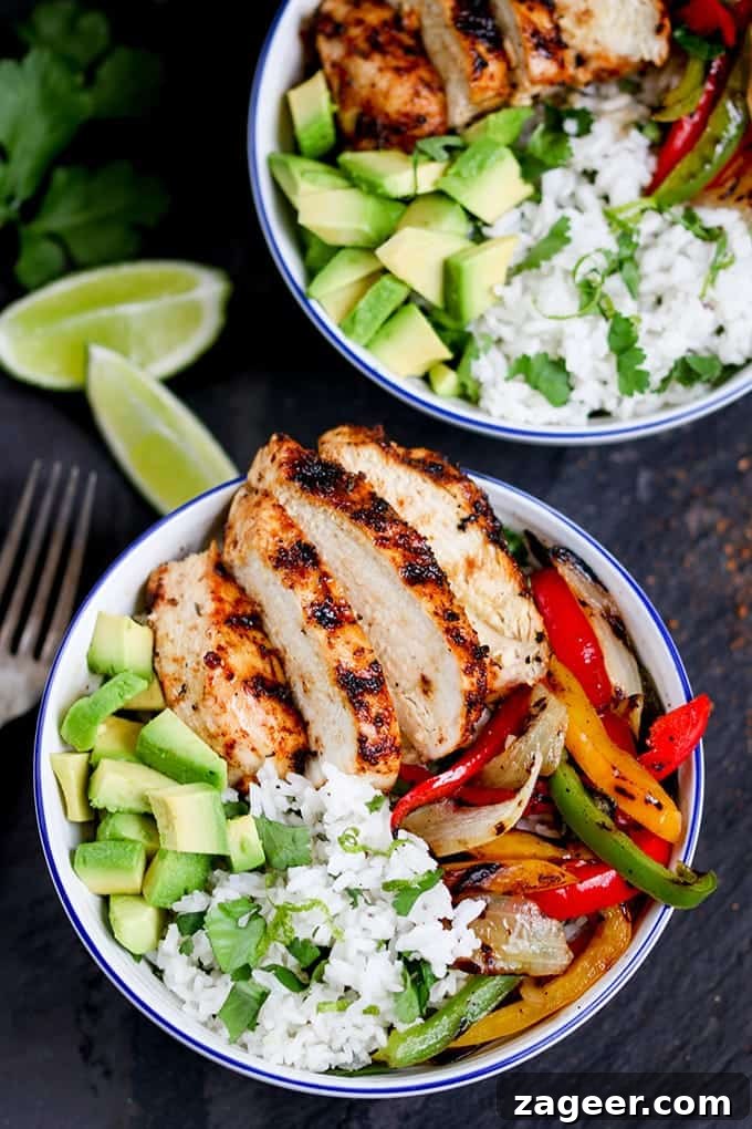 Bright Cilantro Lime Rice with Fiery Cajun Chicken 4 Overhead photo of a generous portion of Cajun chicken, featuring charred bell peppers and onions, alongside fresh coriander-lime rice.