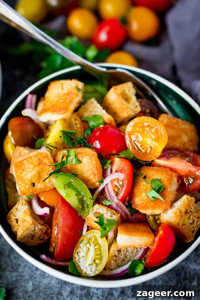 Flaming Saganaki Panzanella 2 Panzanella Salad with Saganaki - Italy meets Greece in this juicy Tuscan tomato salad with crispy fried Greek cheese.