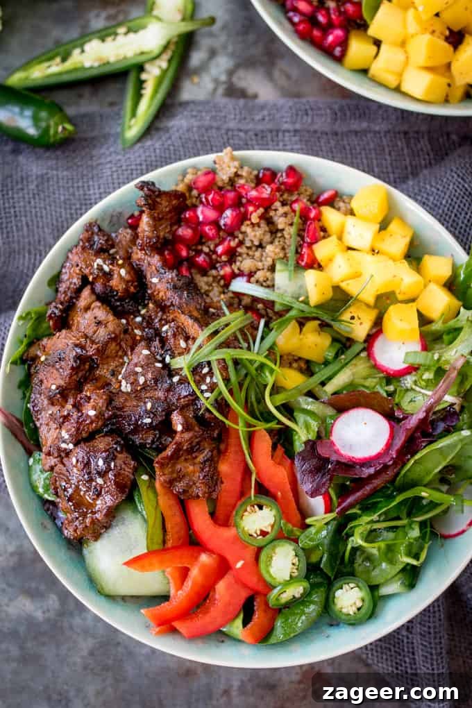 Overhead close-up photo of Korean Beef Bulgogi slices arranged artfully in a bowl, highlighting the marinade.