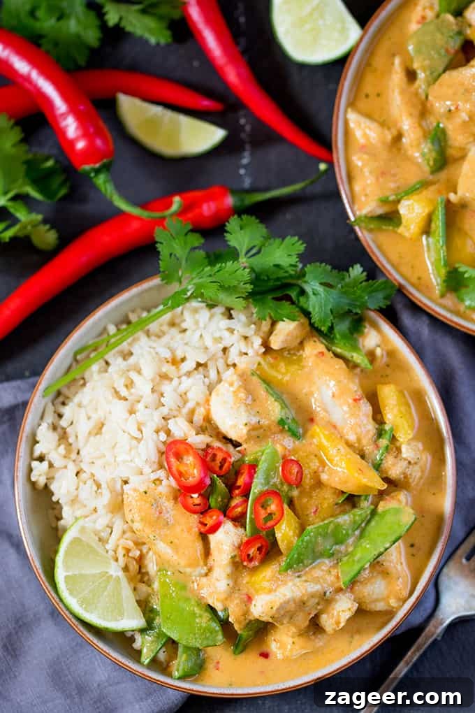 Lighter Homemade Red Thai Chicken Curry 4 Cooking chicken and vegetables in a pan, infused with the homemade red curry paste.