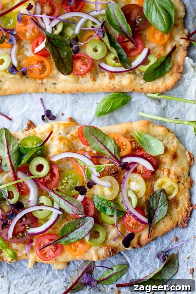 Summer Tomato Pizza with Basil Garlic Butter (Vegetarian) 4 A close-up view of the Vegetarian Summer Tomato Pizza with Basil Garlic Butter, showcasing the golden-brown crust and melted cheese, ready for fresh toppings. The simple no-knead base is highlighted.
