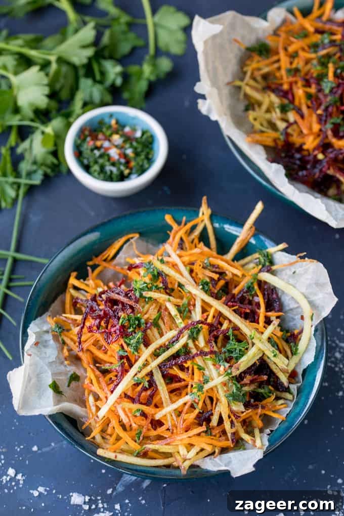 Crispy Veggie Sticks with Artisan Herb Salt 2 Crispy Vegetable Matchstick Fries with a sprinkle of Homemade Herb Salt, a vibrant and healthy snack alternative.