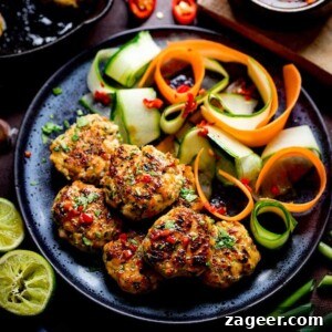 Thai Fishcake Bites and vegetable ribbons on a dark plate