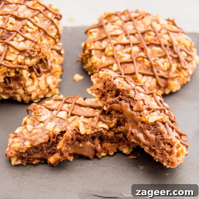Gluten-Free Hazelnut Nutella Cookies Recipe 5 Gluten Free Hazelnut Nutella Cookies - Soft oat flour chocolate biscuits, rolled in hazelnuts and filled with a gooey chocolate centre.