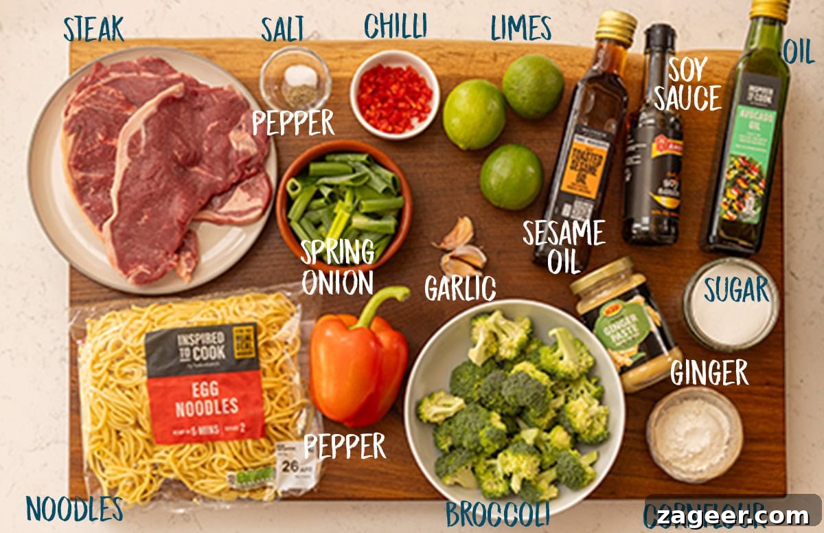 Crispy Chili Beef Noodles Recipe for Flavorful Weeknight Dinner 3 An overhead shot of the ingredients for Crispy Chilli Beef Noodles is set out on a wooden board.
