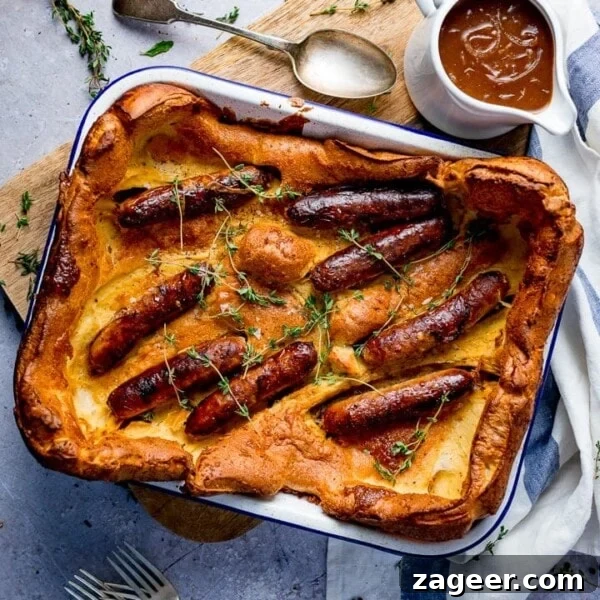 Authentic Cornish Pasty Recipe: Traditional British Meat Pasty Guide 10 Overhead of toad in the hole on light background with jug of gravy