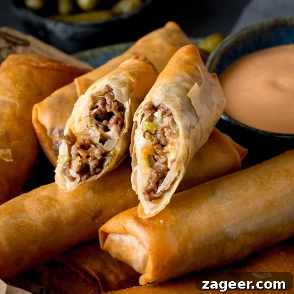 Crispy Loaded Potato Skins with Cheddar, Bacon & Sour Cream 17 Cheeseburger Spring Rolls on a wooden board