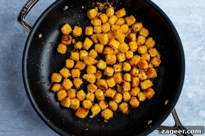 Ratatouille with Baked Feta Croutons: Simple Rustic Vegetable Bake 8 Coated feta cubes being fried in a pan