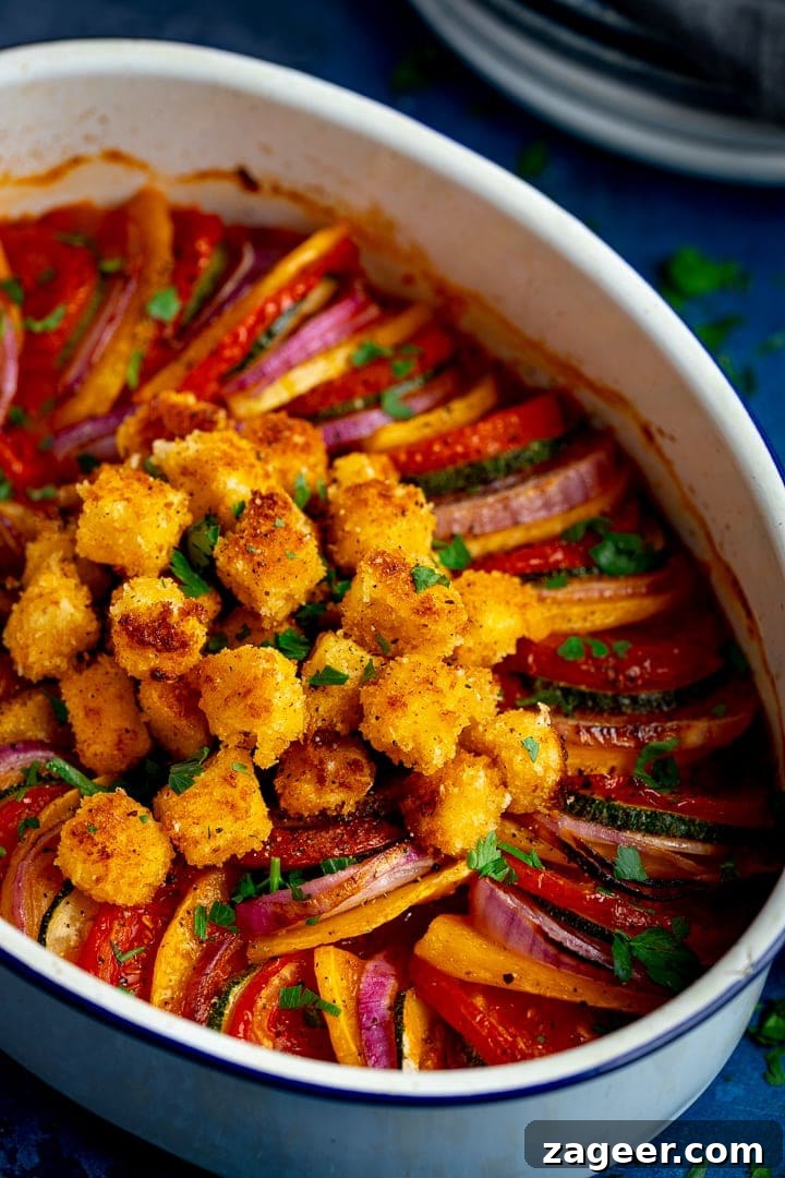Ratatouille with Baked Feta Croutons: Simple Rustic Vegetable Bake 9 ratatouille with crispy feta croutons in a white baking dish