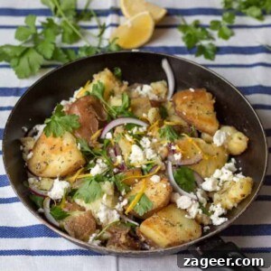 Greek-Style Potato Hash with Feta and Herbs 6 Pan of Greek potatoes with feta, red onion and parsley on a blue and white striped tea towel