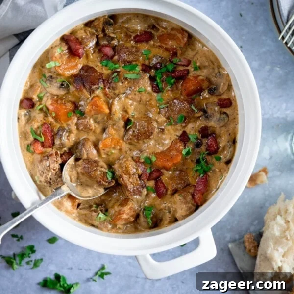Creamy Pork and Apple Casserole Recipe with Herbed Crust 11 Overhead image of creamy pork and bacon casserole in a white casserole pan