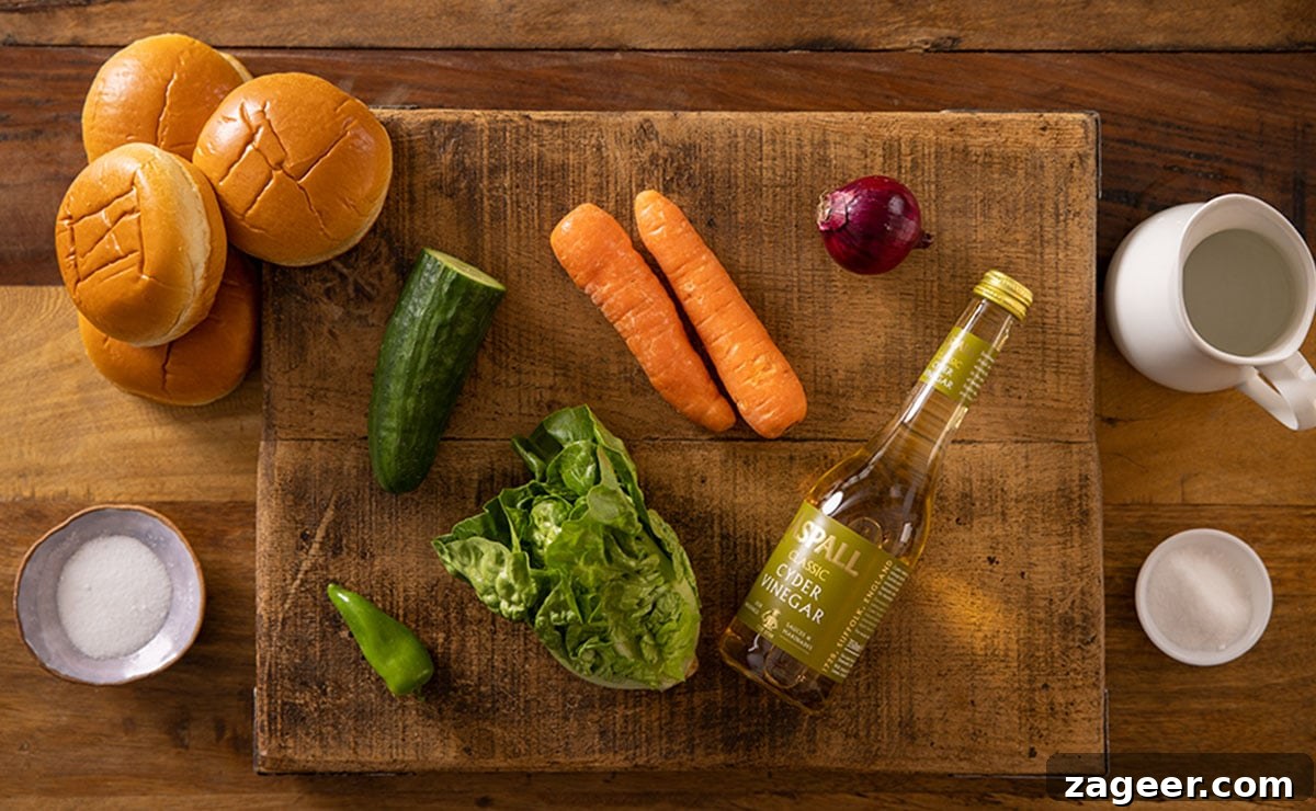 Sticky Glazed Pork Burger with Quick Pickled Veggies 4 Ingredients for quick pickled veg for my sticky pork burger on a wooden board.