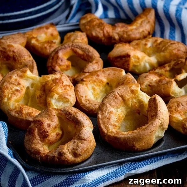 Three-Cheese Brussels Sprout Gratin Recipe for Crispy, Melty Comfort 8 Yorkshire puddings in a tin on a wooden table