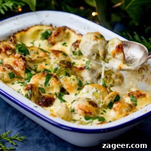 Three-Cheese Brussels Sprout Gratin Recipe for Crispy, Melty Comfort 10 3 cheese sprout gratin, with one sprout being lifted with a spoon.