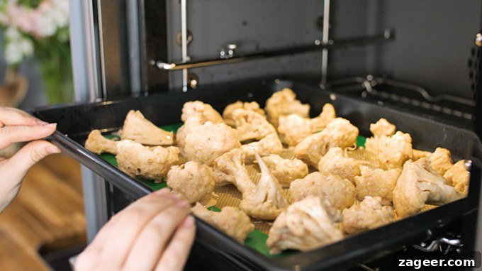 Asian-Style Baked Cauliflower Wings: Sticky Sesame Chili Recipe 5 Cauliflower florets going into the oven