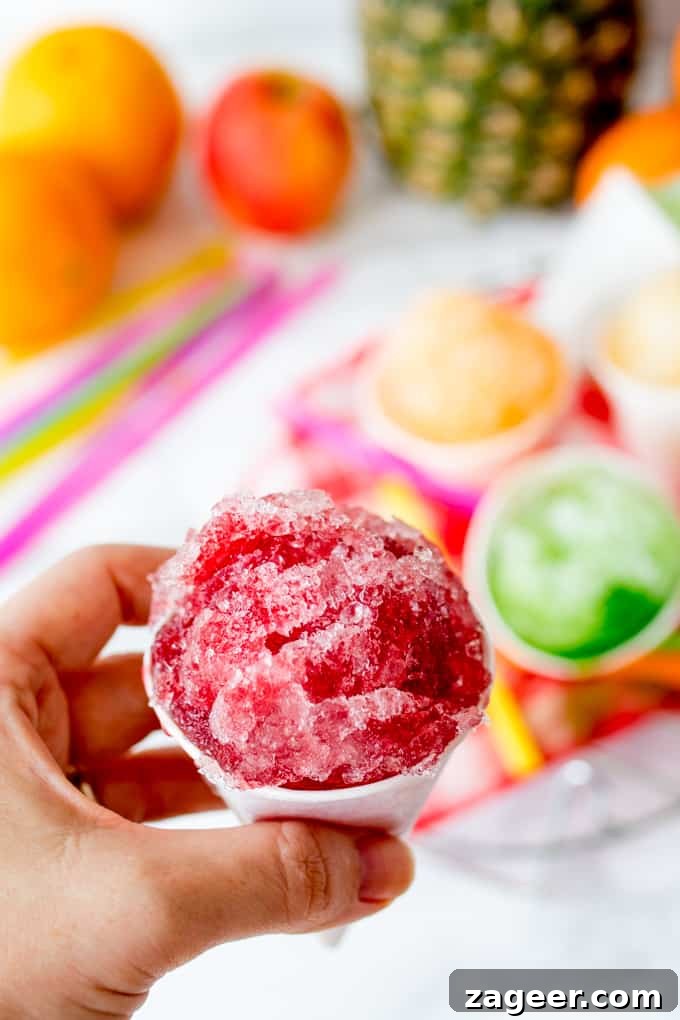 hand holding cherry flavoured snow cone