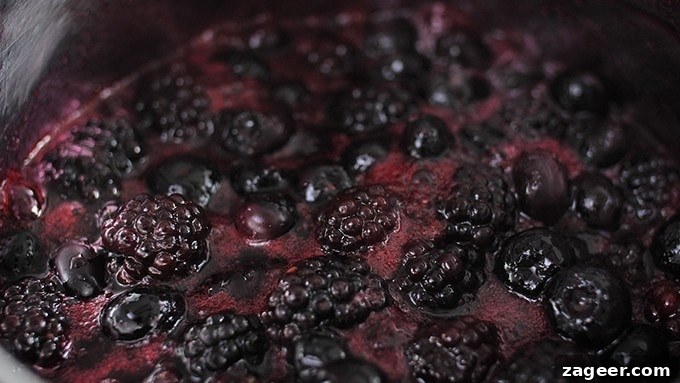 Mini No-Bake Berry Cheesecakes: Individual Dessert Cups 8 Blueberries and blackberries simmering in pan