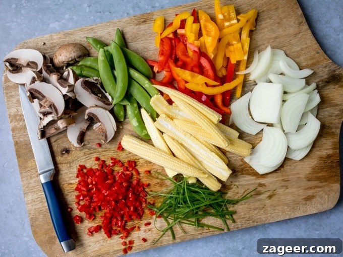 Honey-Soy Chicken Stir-Fry with Spicy Asian Noodles 3 Chopped vegetables on a board for a stir fry