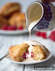Raspberry Almond Pithivier Recipe: Flaky Pastry with Nutty Filling 3 Raspberry and Almond Pithiviers - Golden flaky pastry filled with frangipane and raspberries.