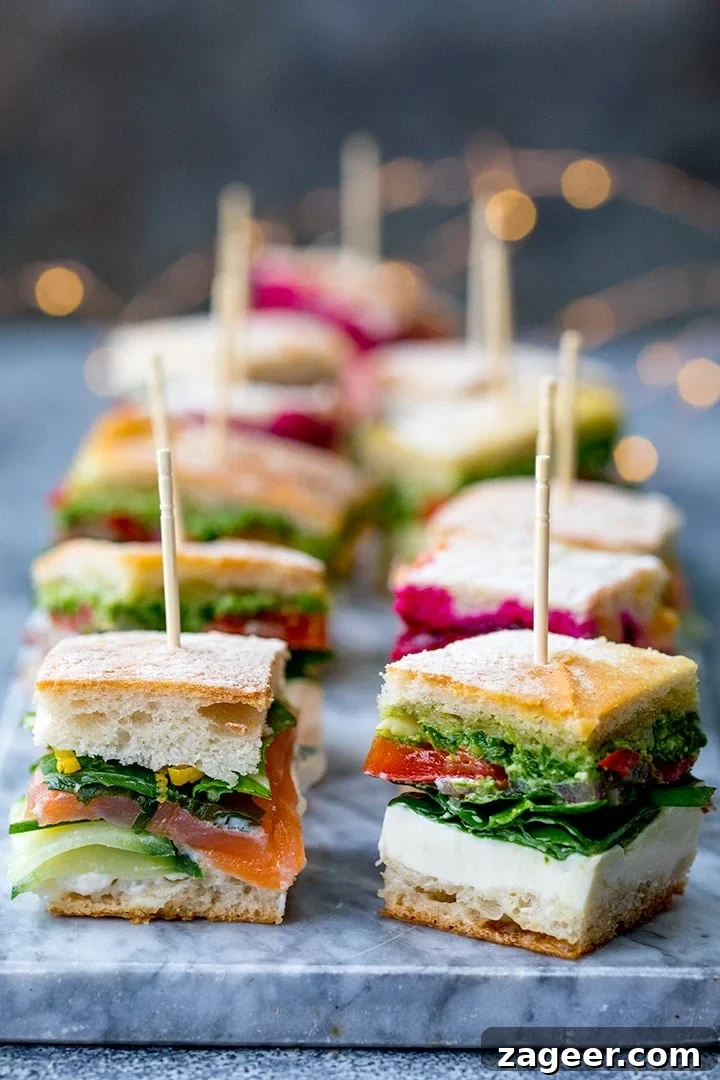 French Press Sandwich Bites: Crispy Mini Grilled Sandwiches 2 Mini sandwich bites with different fillings on a marble platter