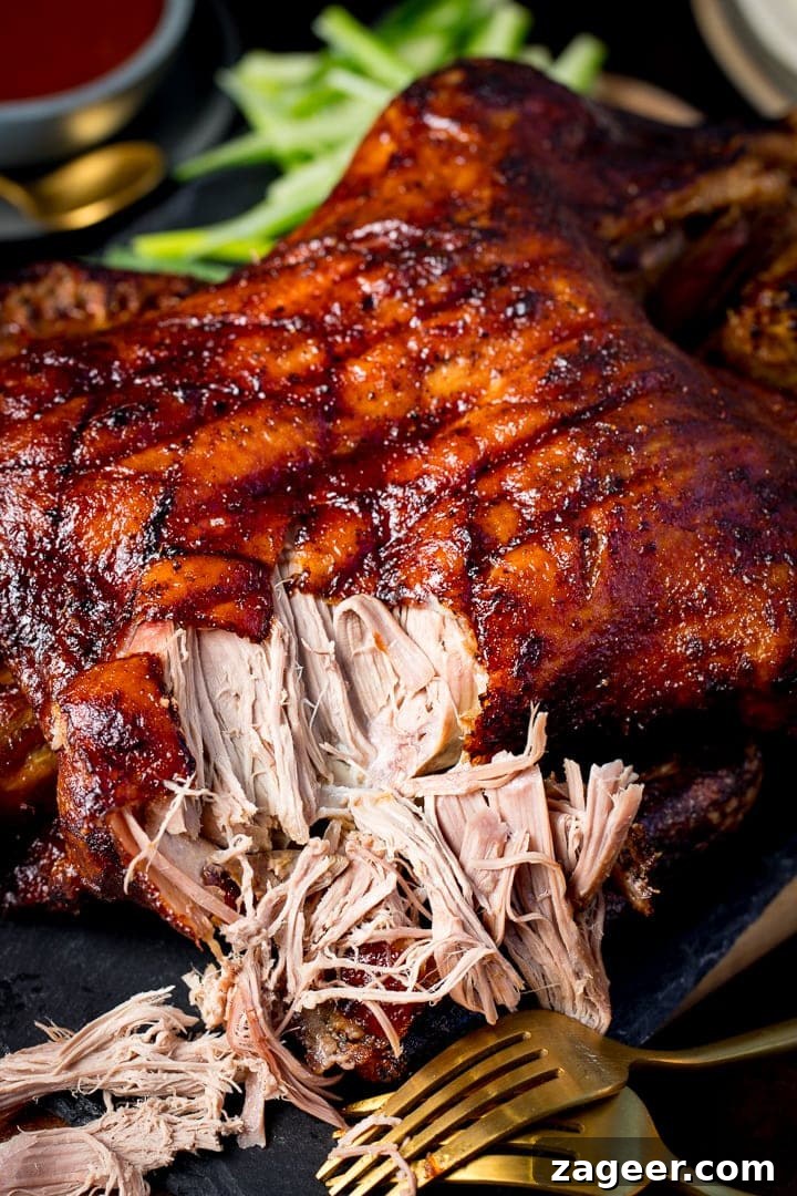 Crispy Homemade Roast Duck Recipe for Perfectly Crunchy Skin 7 Chinese crispy duck on a slate board with some of the meat shredded