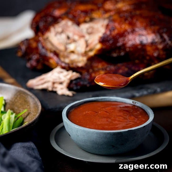 Crispy Homemade Roast Duck Recipe for Perfectly Crunchy Skin 8 plum sauce in a bowl with shredded duck int he background