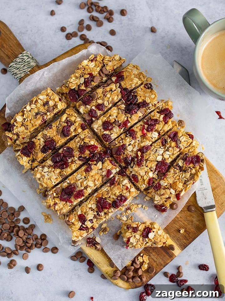 No-Bake Peanut Butter Granola Bars Recipe (Quick & Chewy) 7 Peanut Butter Granola Bars sliced on a chopping board