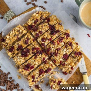 No-Bake Peanut Butter Granola Bars Recipe (Quick & Chewy) 4 Overhead image of peanut butter, chocolate and cranberry granola bars chopped into slices