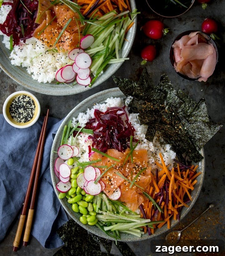 Salmon Sushi Bowl Recipe: Homemade Poke-Style Salmon Bowl 3 Overhead image of a salmon sushi bowl with a blue napkin and wooden chopsticks