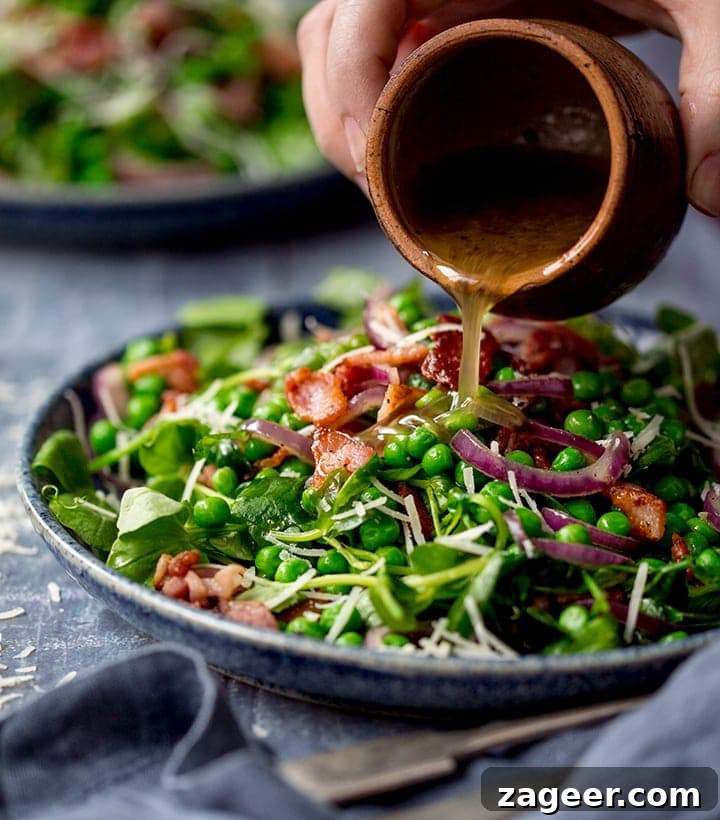 Salmon Sushi Bowl Recipe: Homemade Poke-Style Salmon Bowl 9 Dressing being poured onto a bacon and pea salad