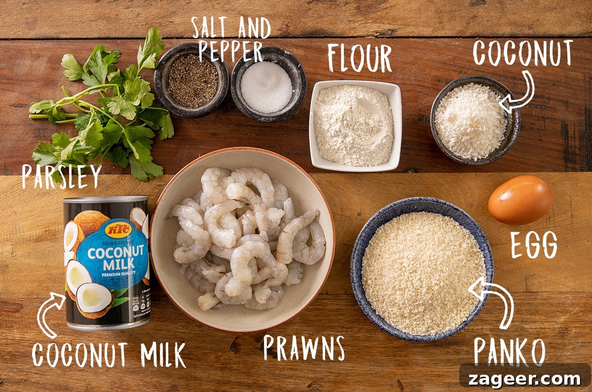 Crispy Coconut Shrimp Recipe with Mango Dipping Sauce 3 Ingredients for coconut shrimp on a wooden table