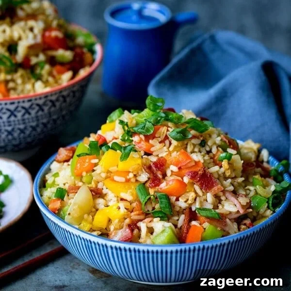 Perfectly Cooked Rice: Step-by-Step Guide for Fluffy Grains 13 Bowl of fried rice on blue background