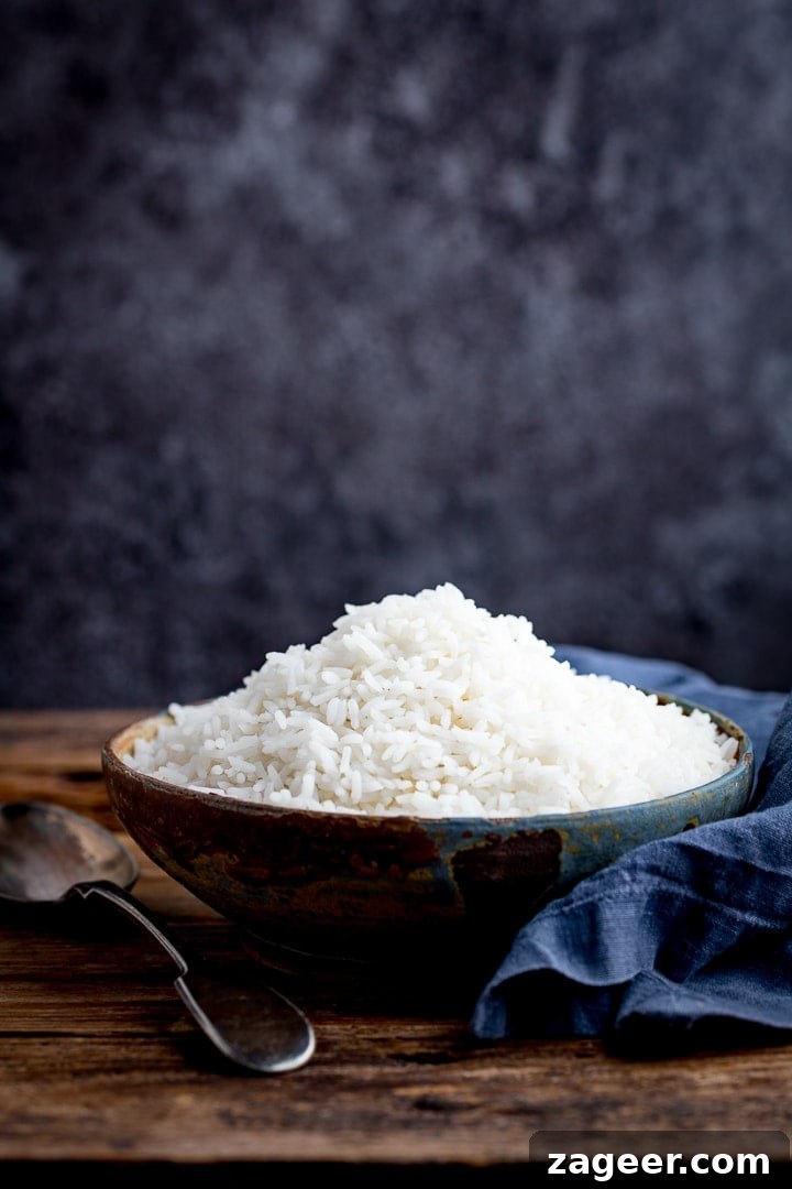 Perfectly Cooked Rice: Step-by-Step Guide for Fluffy Grains 6 Boiled rice in a bowl on a wooden table