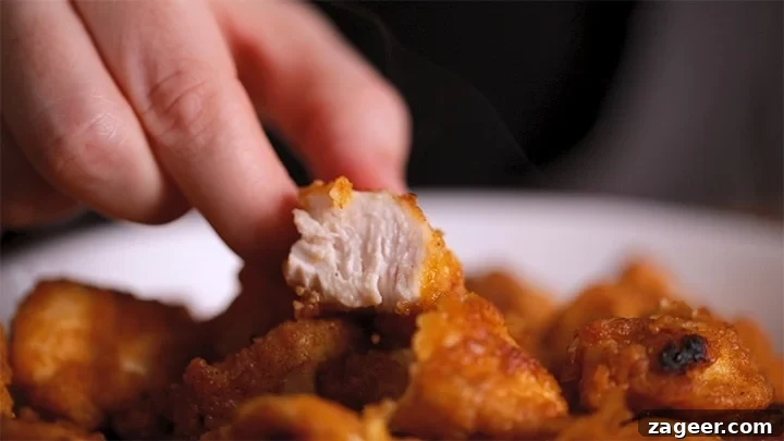 Authentic Sweet and Sour Chicken Recipe for Sticky, Tangy Sauce 4 Piece of crispy chicken sliced in half