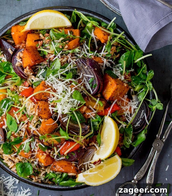 Winter Vegetable Noodle Salad with Citrus-Ginger Dressing 7 Overhead of Roasted Vegetable and Herby Wild Rice Salad with a pair of salad tongs to the side
