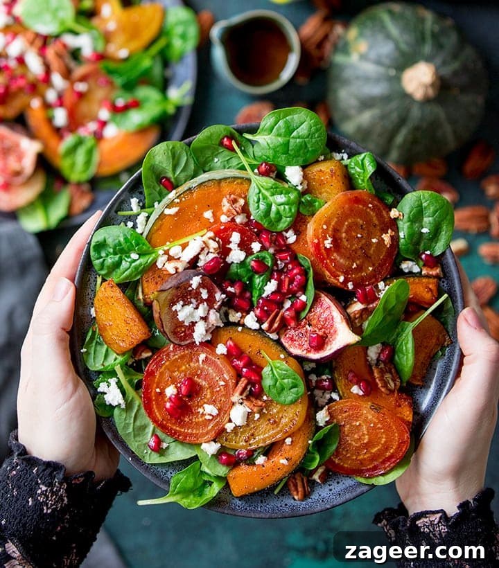 Winter Vegetable Noodle Salad with Citrus-Ginger Dressing 8 Hands holding a bowl of Roasted acorn squash salad