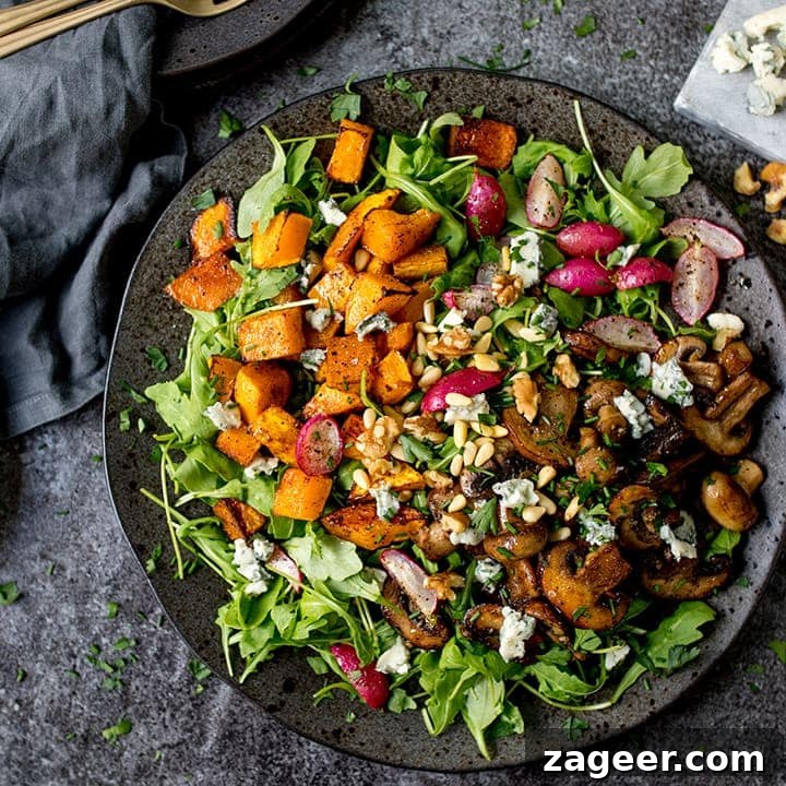 Winter Vegetable Noodle Salad with Citrus-Ginger Dressing 10 Garlic mushroom and roasted squash salad on a dark plate on a dark background