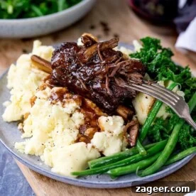 Top Slow Cooker Recipes for Flavorful Weeknight Meals 13 Short ribs with rich gravy served on mashed potatoes