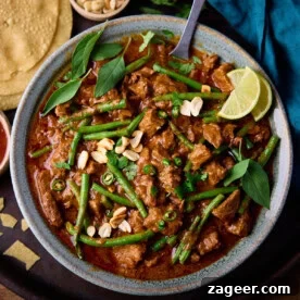 Top Slow Cooker Recipes for Flavorful Weeknight Meals 14 Slow Cooker Thai Red Beef Curry in a bowl