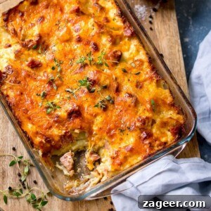 Creamy Scalloped Potatoes with Ham and Cheese Bake 17 Scalloped potatoes with ham in a dish, with a scoop taken out