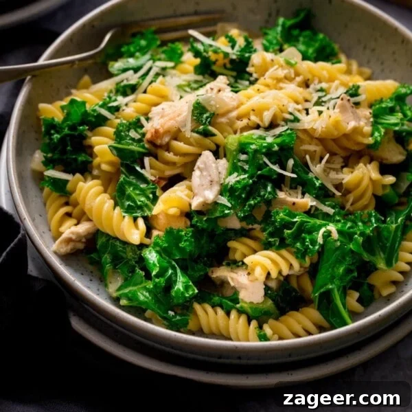 Creamy Chicken à la King Recipe — Classic Comfort Dish 10 Close up of a bowl of garlic chicken pasta and kale
