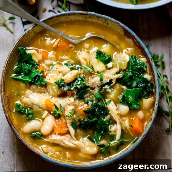 Creamy Chicken à la King Recipe — Classic Comfort Dish 11 A bowl of Tuscan soup with kale, cannellini beans, carrots, and chicken